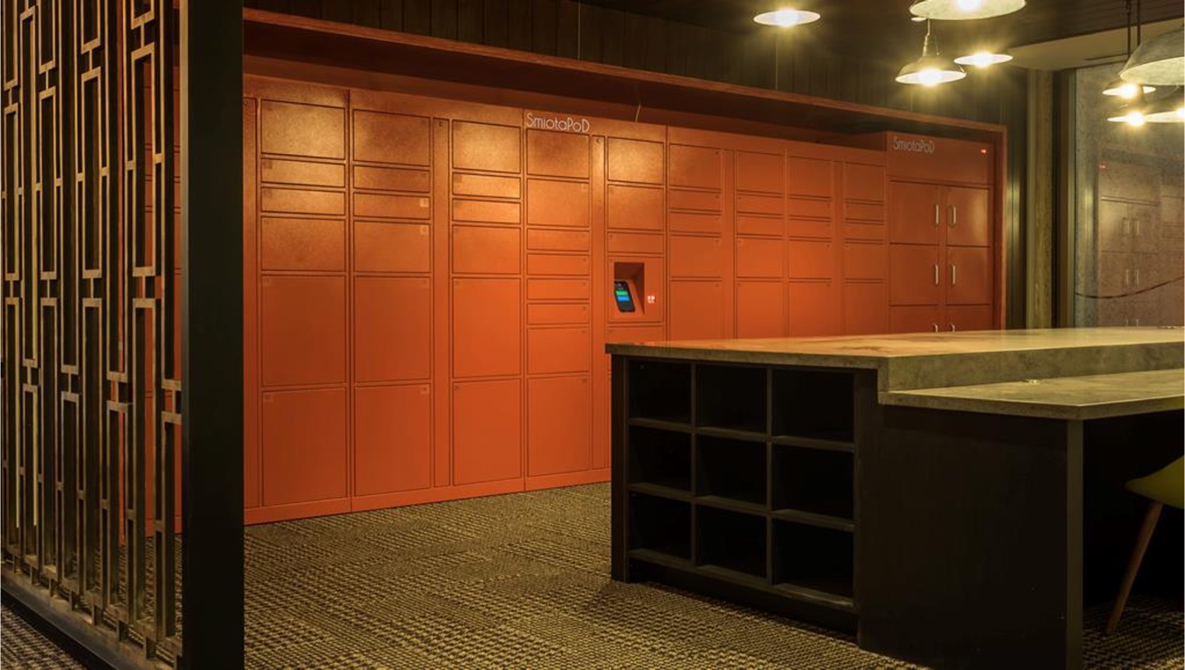 SmiotaPoD smart package lockers in an apartment building lobby