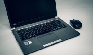laptop and mouse on a table